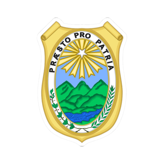 Gold scroll-topped badge with a white sunburst star above green mountains and a blue river, lettered around the rim.