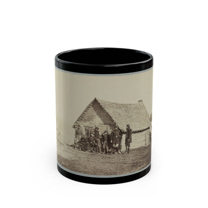 A Group Of Soldiers, And Two Young Men, One An African American, Stand Outside Of Log Cabin Quarters (U.S. Civil War) Black Coffee Mug