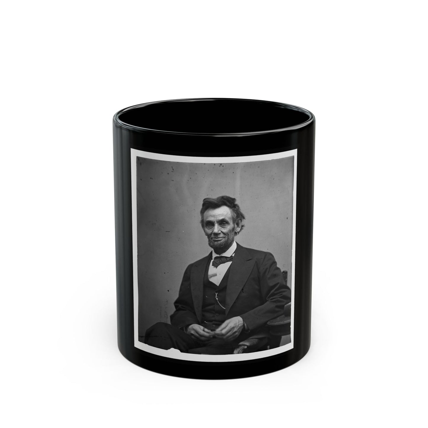 Abraham Lincoln, Three-Quarter Length Portrait, Seated And Holding His Spectacles And A Pencil (U.S. Civil War) Black Coffee Mug