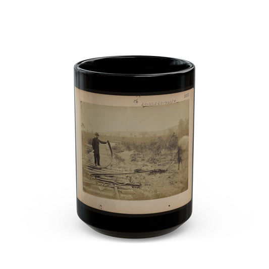 Military Railroad Operations In Northern Virginia Man Standing On Railroad Tracks Holding Twisted Rail (U.S. Civil War) Black Coffee Mug-15oz-The Sticker Space