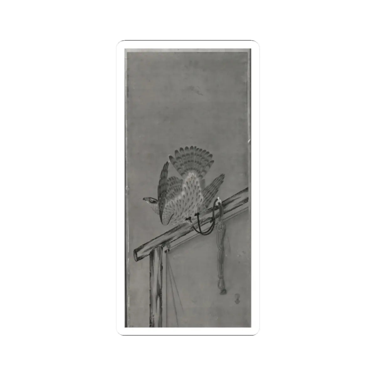 Grey monochrome view of a painted falcon with spread tail on a wooden perch, with a cord and tassel beside it.