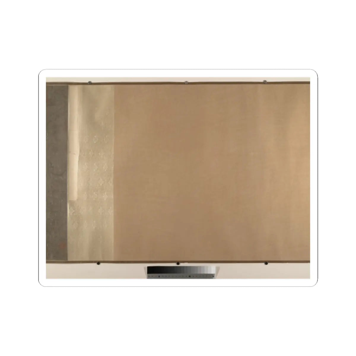 Traditional Asian scroll backing of tan paper beside a light beige patterned silk mounting section.