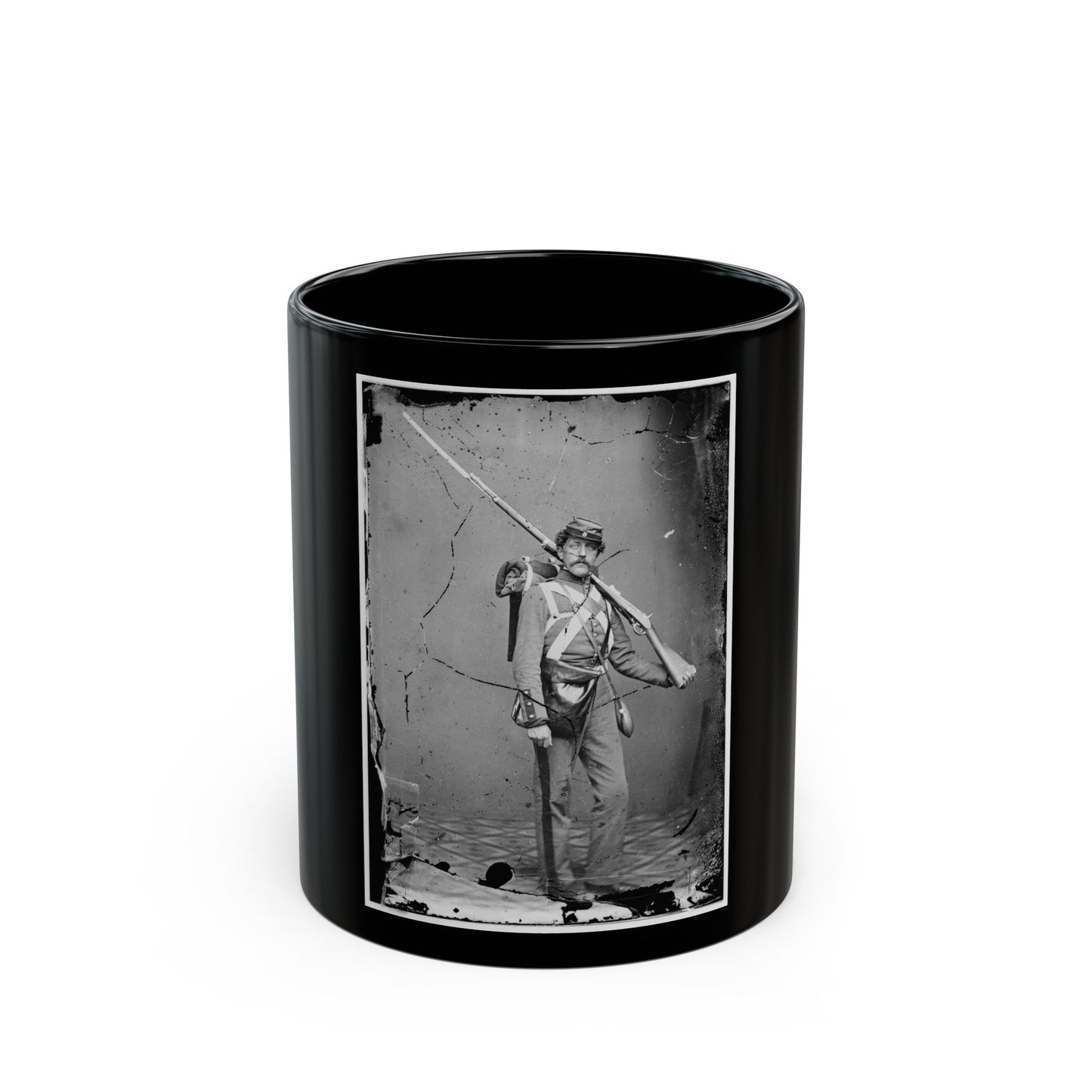 Unknown Location. Unidentified Union Volunteer With Shouldered Rifle And Bayonet In Photographer's Studio (U.S. Civil War) Black Coffee Mug-11oz-The Sticker Space